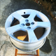 One of the wheels just before sanding. Notice the gouging around the edge of the rim. This wheel was probably the most curbed of the set!